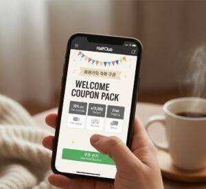 스마트폰 화면에 나타난 '웰컴 쿠폰 팩' 팝업