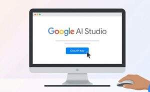 컴퓨터 모니터 화면에 표시된 Google AI Studio 웹사이트의 랜딩 페이지입니다. 사용자의 손이 마우스 커서를 움직여 파란색 'Get API Key' 버튼을 클릭하고 있습니다.